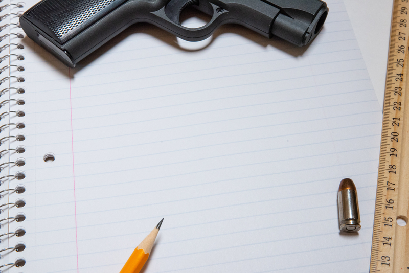 firearm and pencil-notebook